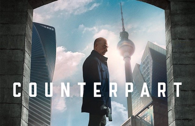 A man stands with his back to the viewer, turned so his face is in profile. Talk buildings crowd in from the sides, but the central background is a blue sky with white clouds. The words "Counterpart" are superimposed