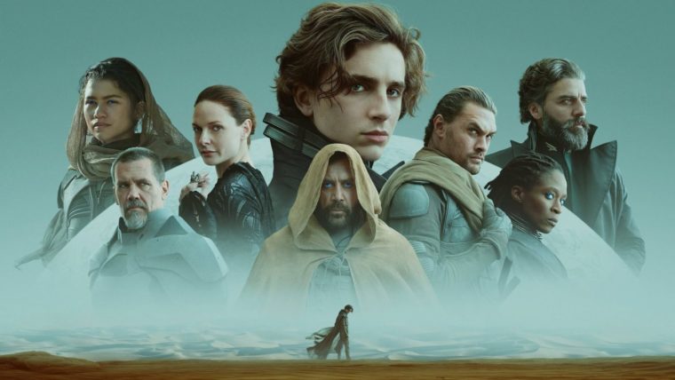 Banner photo of all the main character's in the Villeneuve Dune arrayed along a sandy horizon. Paul Atreides is in the center, looking over his shoulder at the viewer.